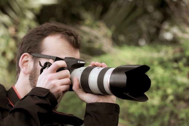 Image of a photographer clicking a photo