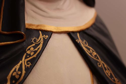 Detail showing the rose vines painted by hand onto the restored St. Rose statue