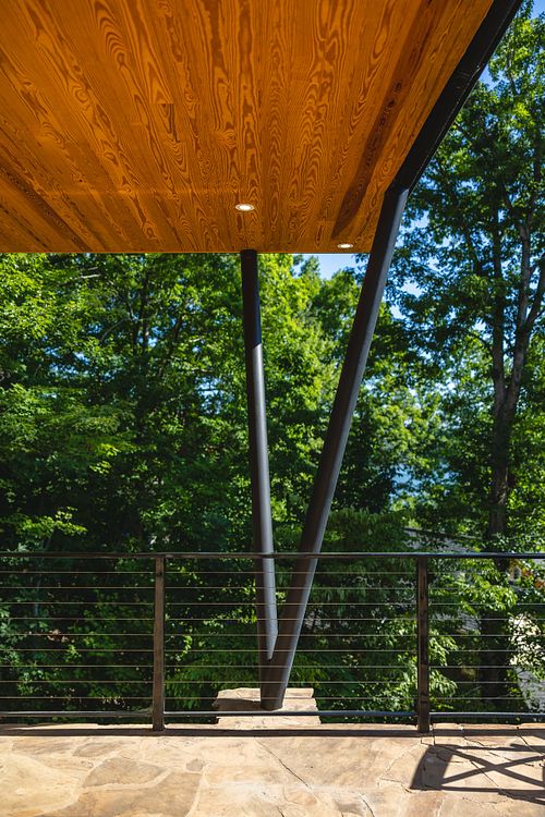 posts, stone patio, wood ceiling