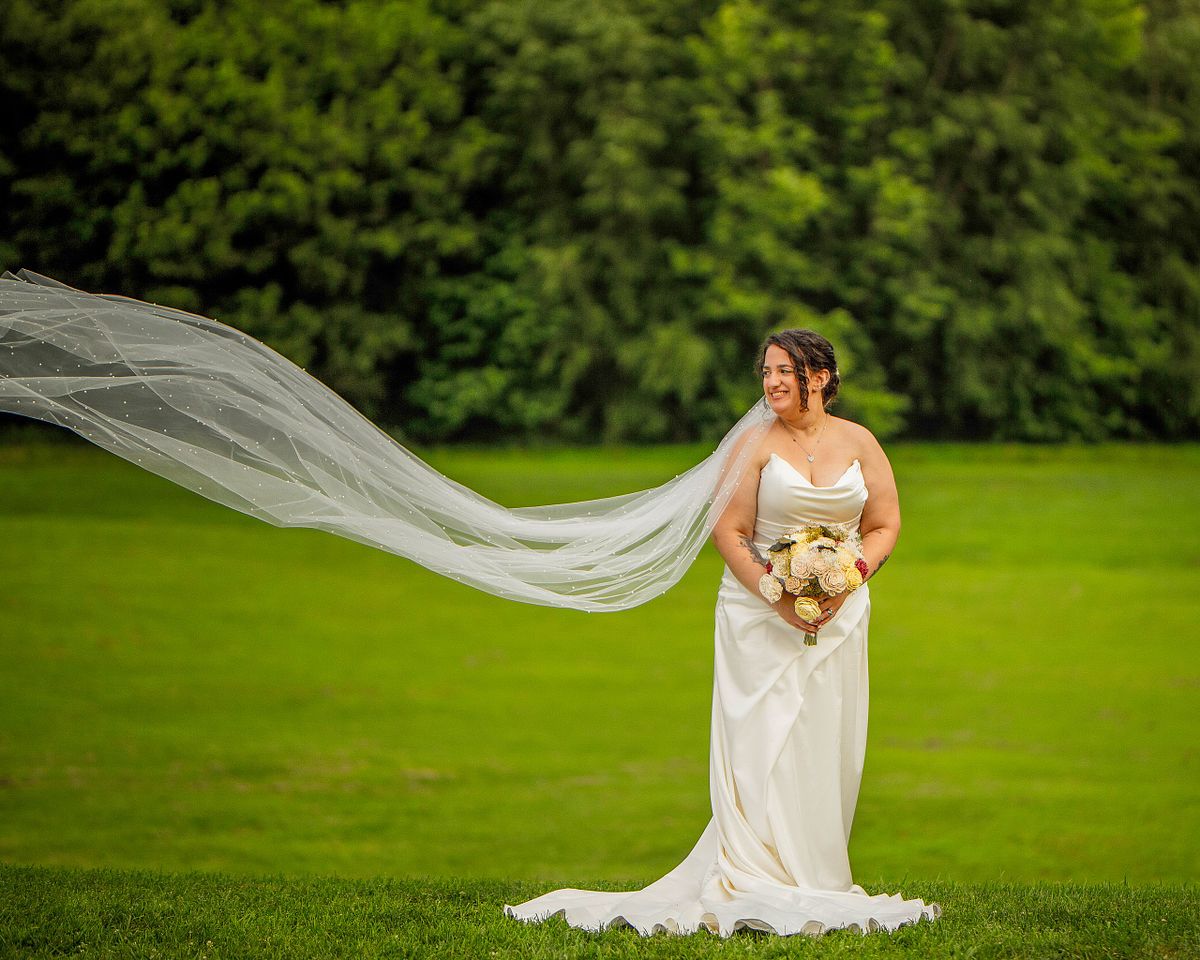 bride posing for photographs at the seneca lodge in boyds, md