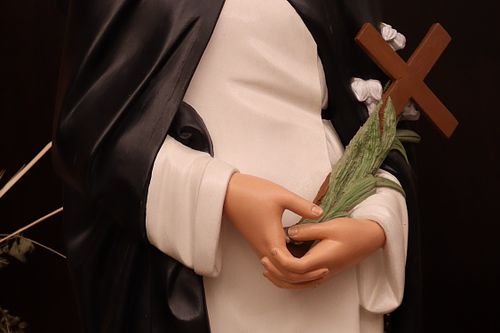 Beautifully repainted hands on the statue of St Catherine of Siena.