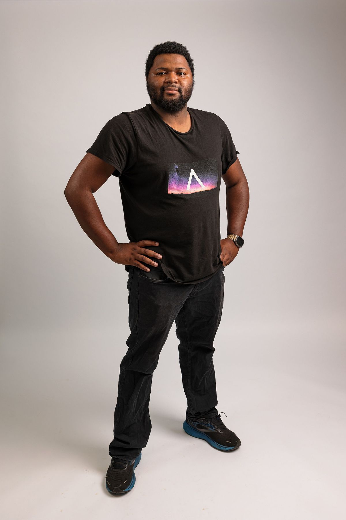 A full body photo of a man against a white backdrop at Innovate Carolina's offices in Chapel Hill, NC